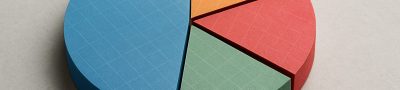 A 3D pie chart made of colorful card stock segments arranged on a neutral background.