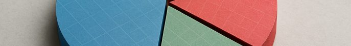 A 3D pie chart made of colorful card stock segments arranged on a neutral background.