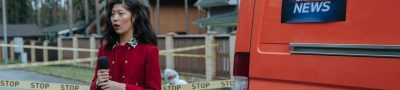 Female reporter in red outfit at an outdoor crime scene with warning tape and a news van. — LTrent Driving School: Expert Tra